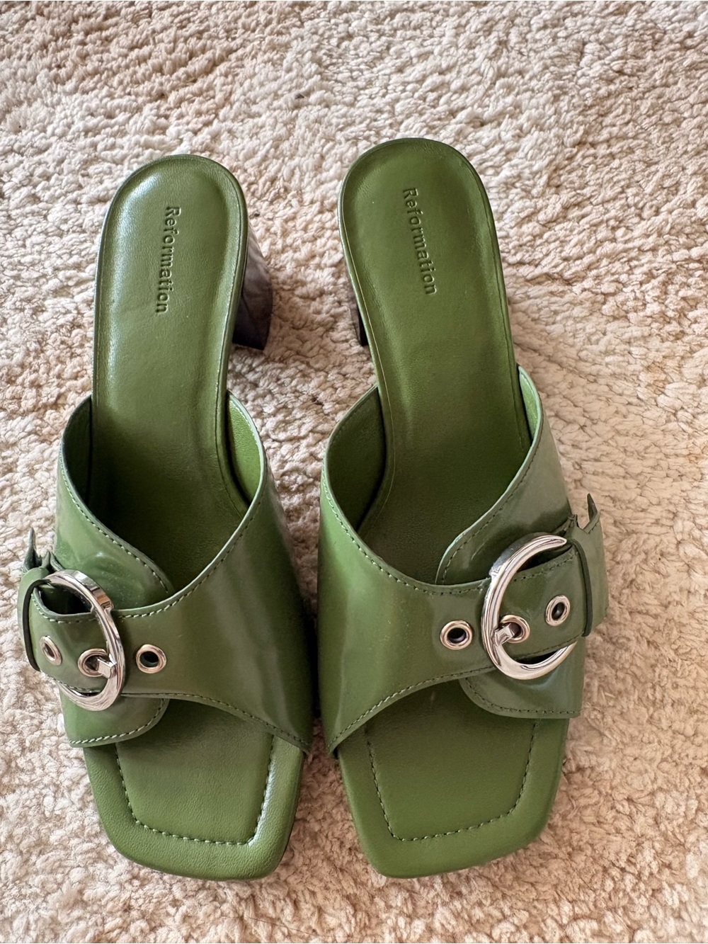 Reformation green leather heel mules with silver buckle detail